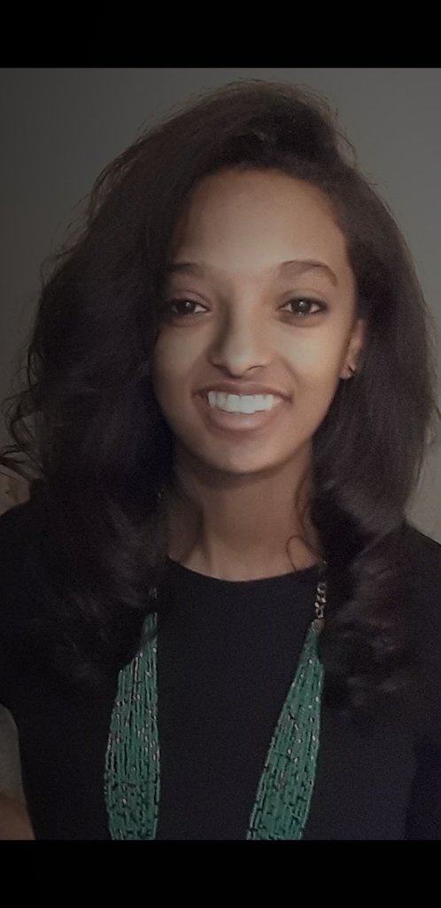 A man in a alice blue shirt with a thinking expression